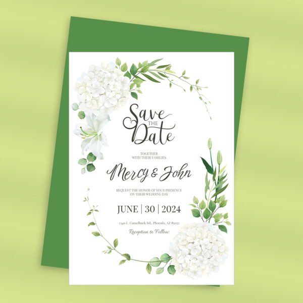 Vertical save the date card with white flower details and delicate handwriting.