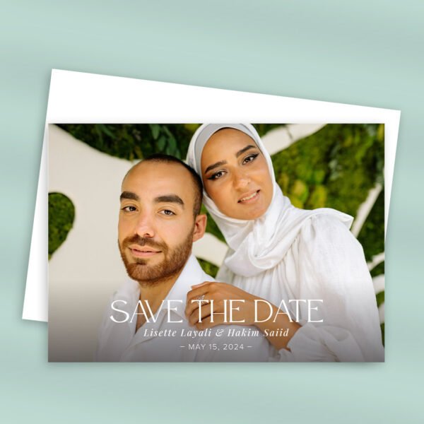 Horizontal save the date card with couple's photo.